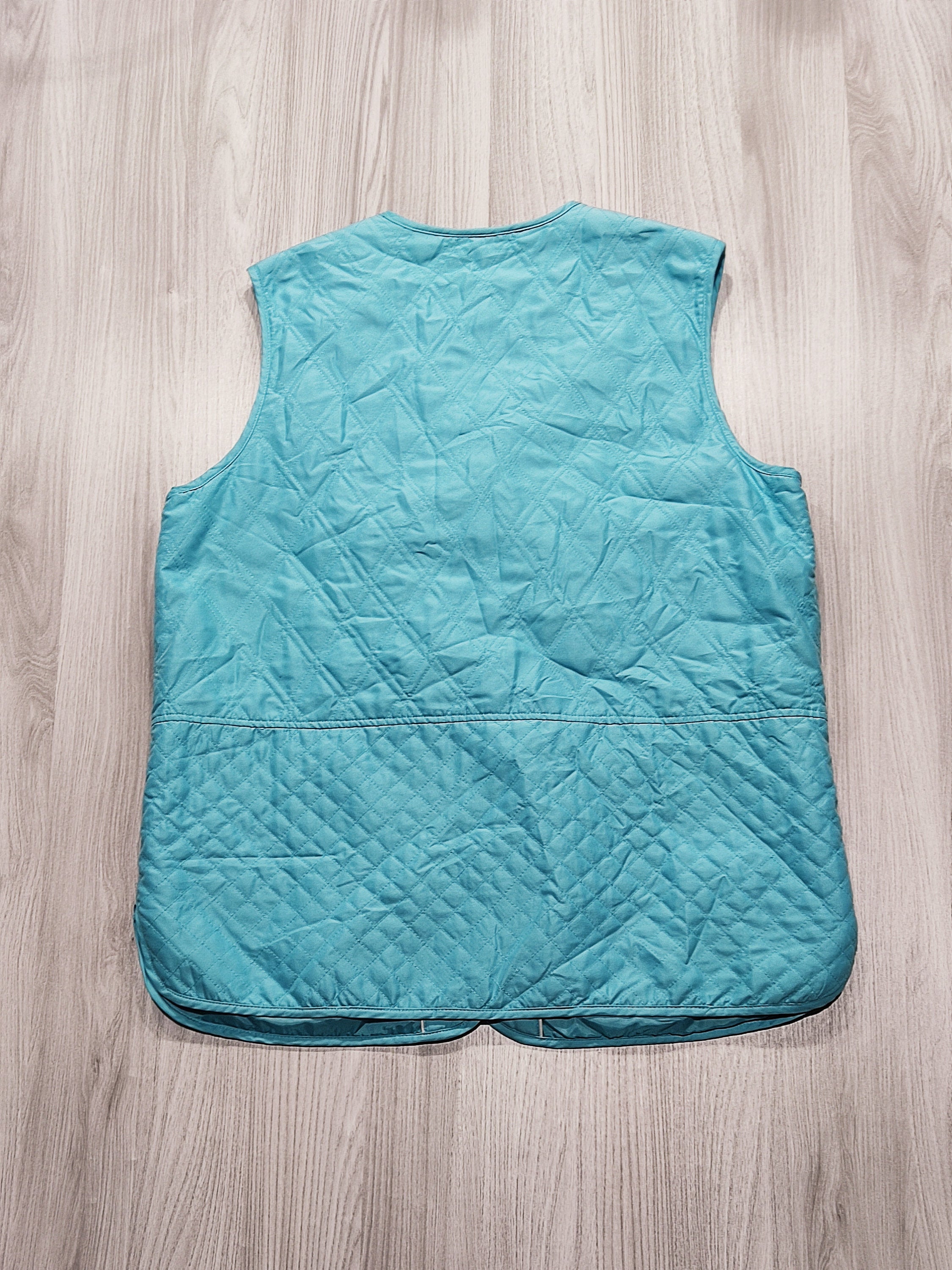 Türkiz steppelt mellény