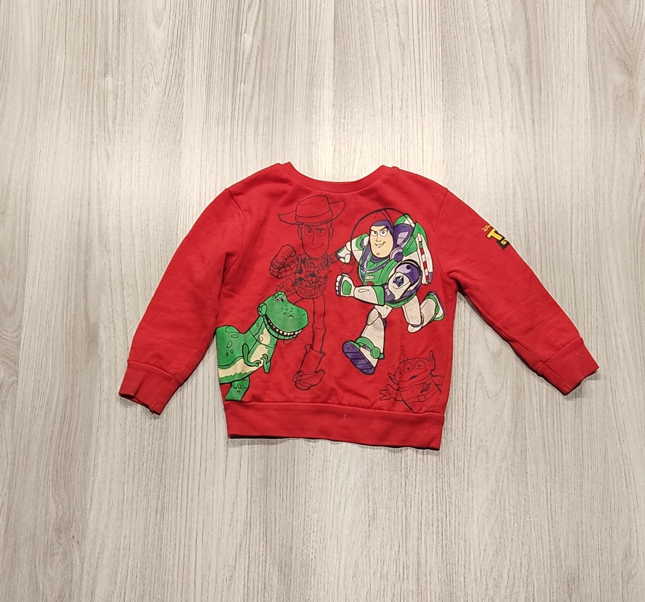 Piros Toy Story mintás pulóver