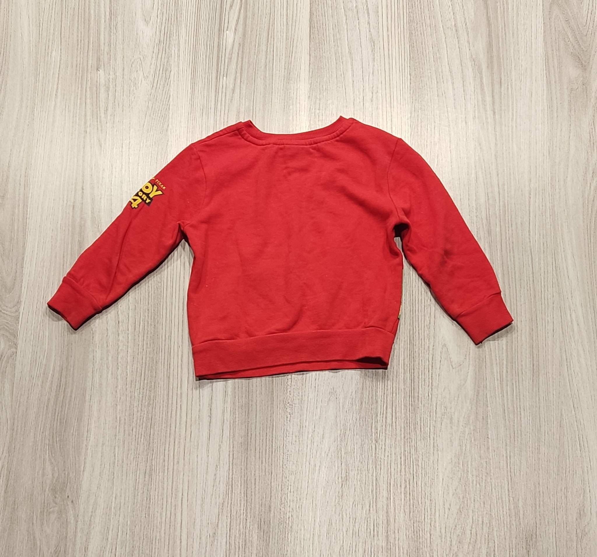 Piros Toy Story mintás pulóver